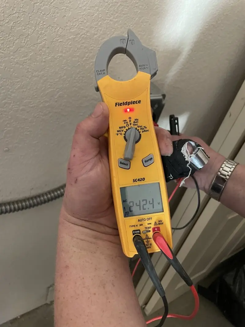 Voltage testing with clamp meter during Whole House Surge Protector in Bridgeport